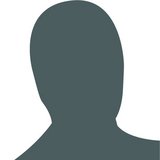 A solid grey avatar of a person on white background