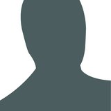 A solid grey avatar of a person on white background