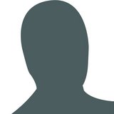 A solid grey avatar of a person on white background